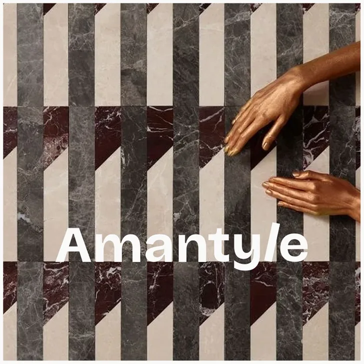 Social post: marble tiles in grey, cream and burgundy with hands laying a tile, over the Amantyle wordmark.
